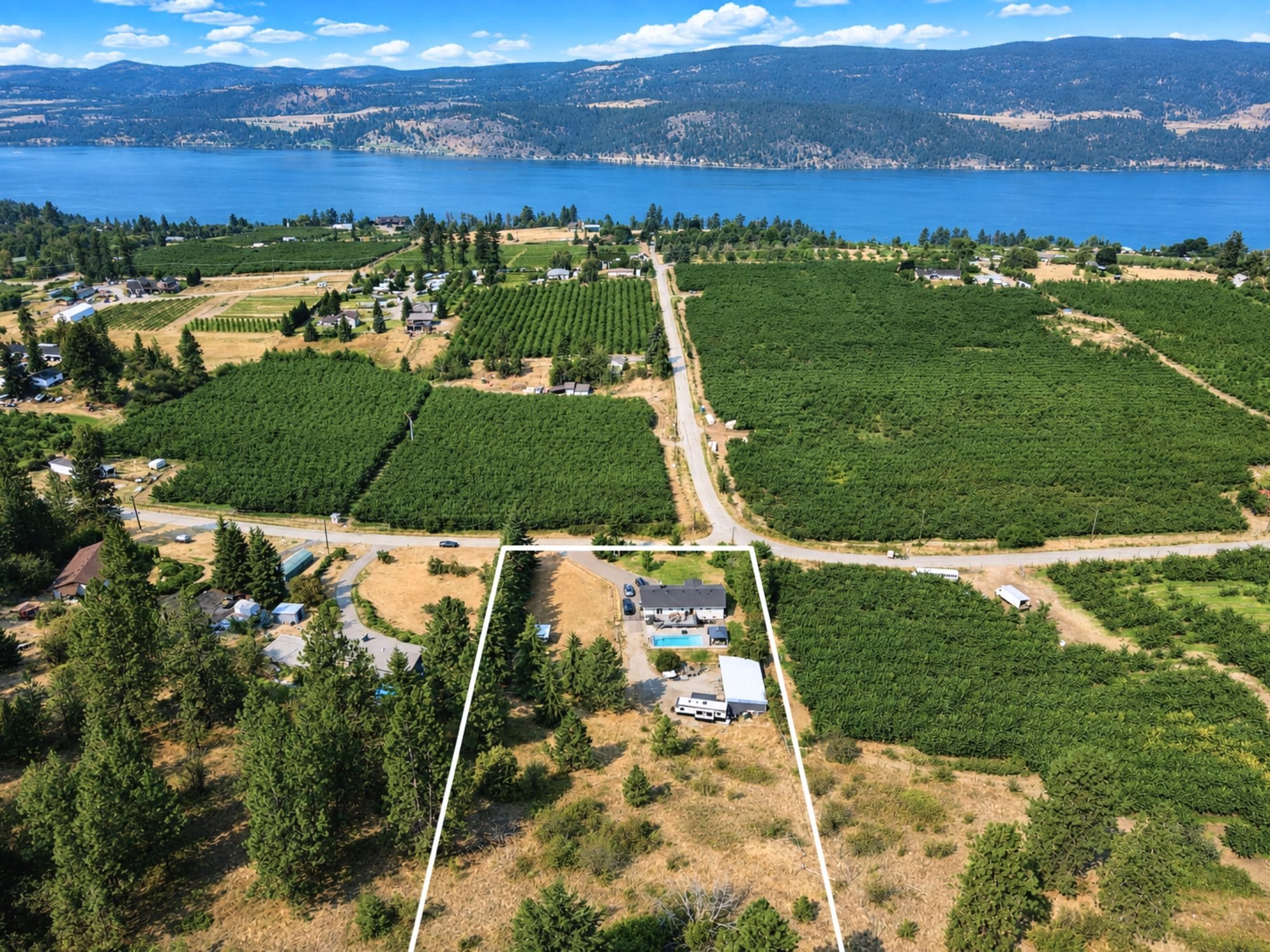 Wood Lake and Kalamalka Lake beyond the orchards of Oyama