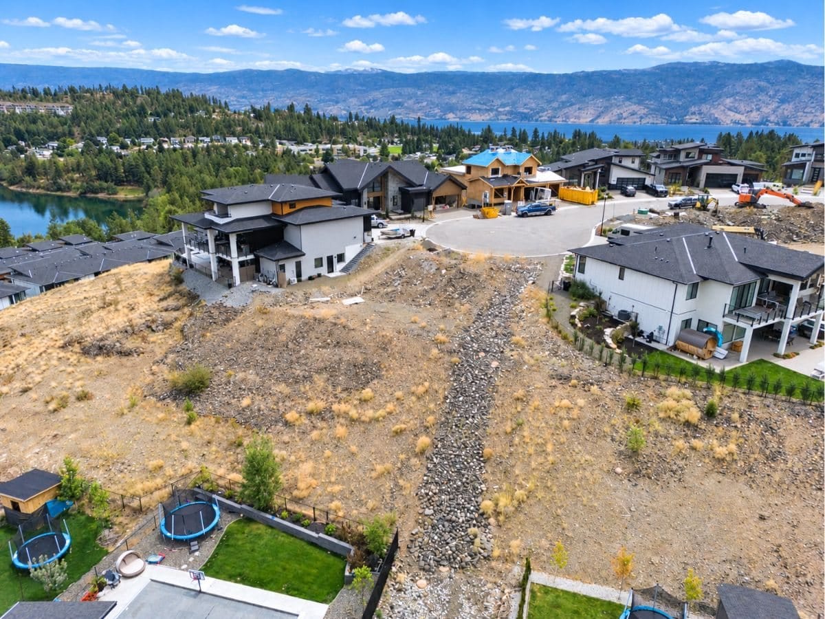 Lot 34 at 2500 Pinnacle Ridge Drive from the air, below the cul-de-sac, with Okanagan Lake and the mountains beyond