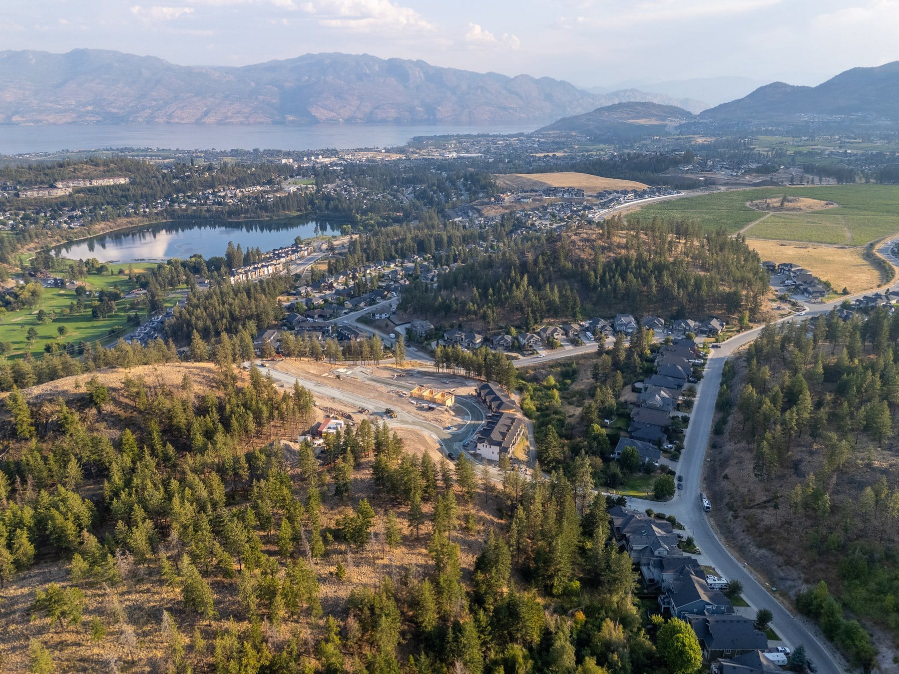 Shannon Lake and the golf course below Paramount Peak and Tallus Ridge, with Okanagan Lake and the valley beyond