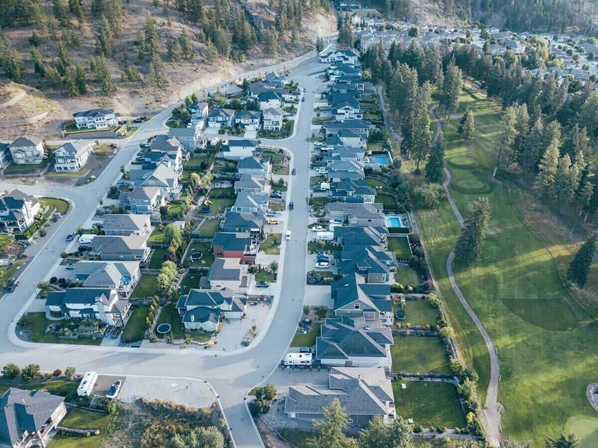 Tallus Ridge streets from the air in Shannon Lake, West Kelowna, with homes backing onto the golf course fairway
