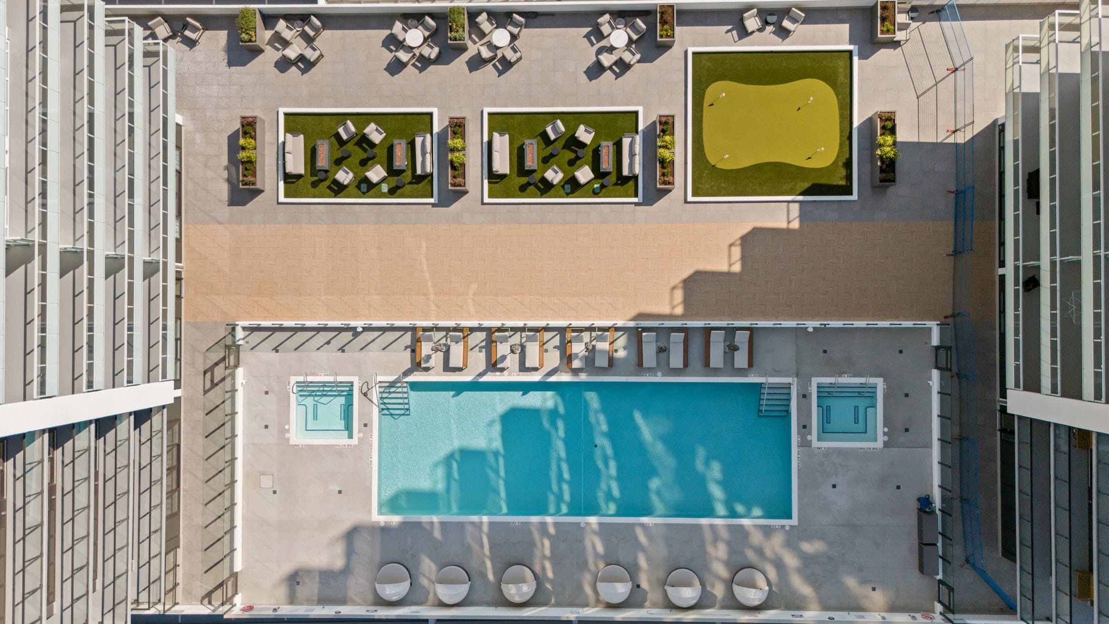 Aerial view of The Deck at Water Street by the Park: pool, hot tubs, cabanas and putting green